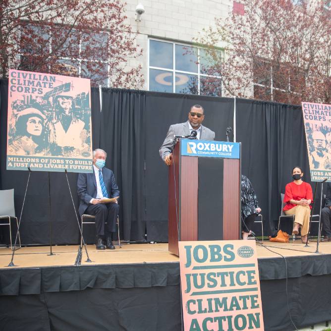 climate conference with sheriff Steve Tompkins addressing audience